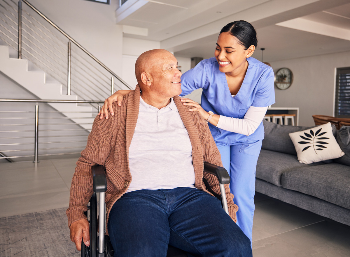 nurse helping man in wheelchair