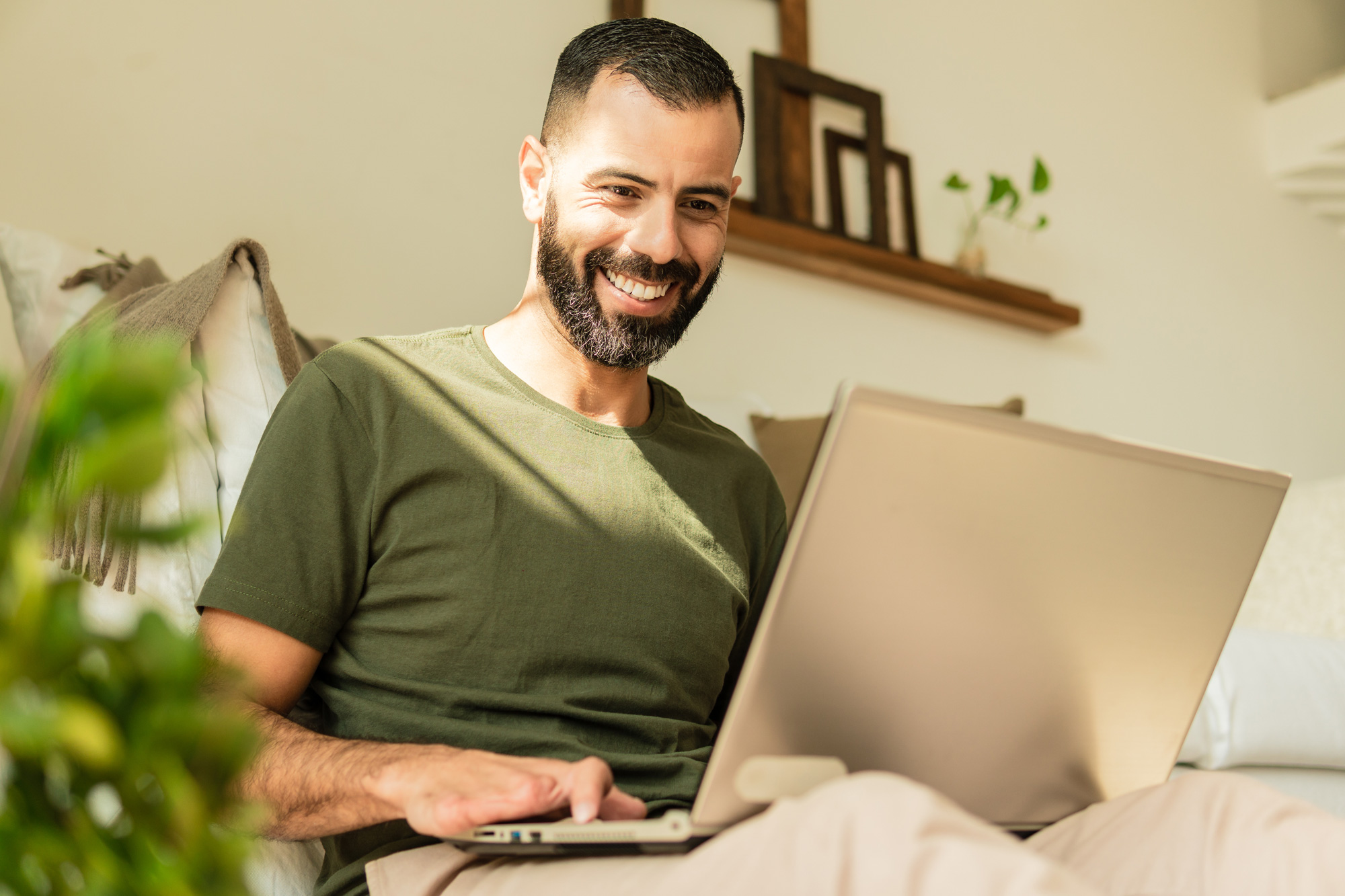 disabled person smiling and using laptop